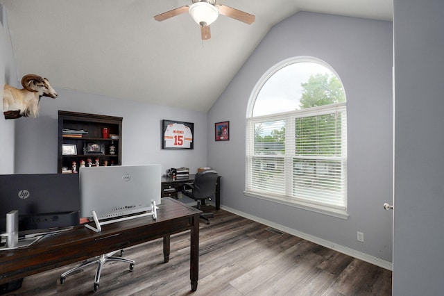 home office with lofted ceiling, visible vents, ceiling fan, and wood finished floors