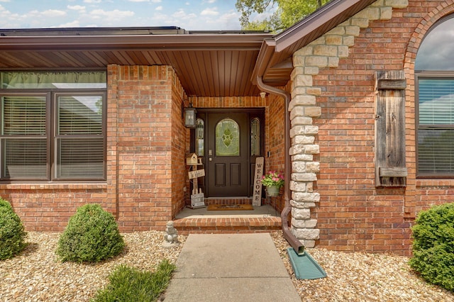 property entrance with brick siding