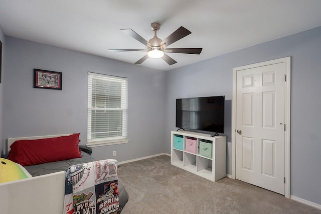 bedroom with baseboards, a ceiling fan, and carpet