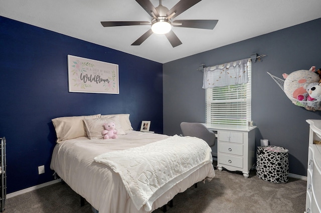 carpeted bedroom with a ceiling fan and baseboards