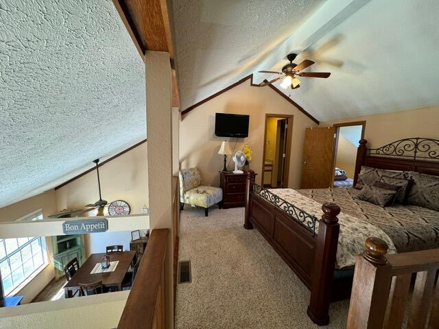 17 Fall Creek Trl Unit 7, Branson, MO 65616 - bedroom with lofted ceiling, carpet, and a textured ceiling