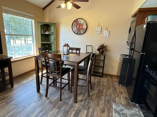 17 Fall Creek Trl Unit 7, Branson, MO 65616 - dining room with vaulted ceiling, baseboards, a ceiling fan, and wood finished floors