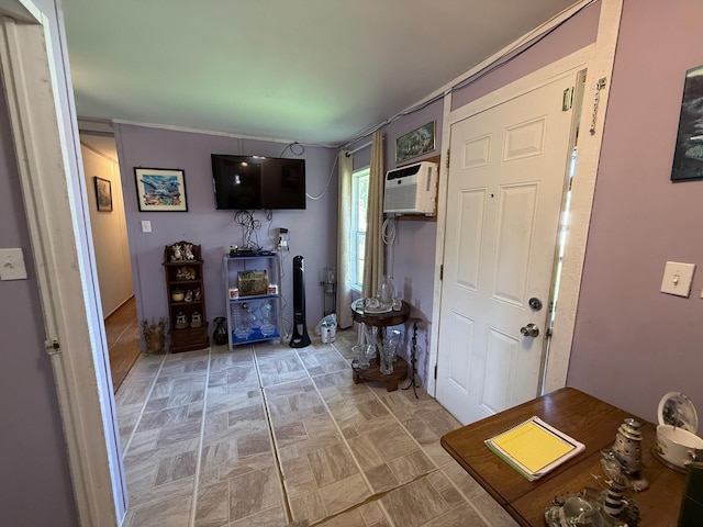 entrance foyer featuring an AC wall unit