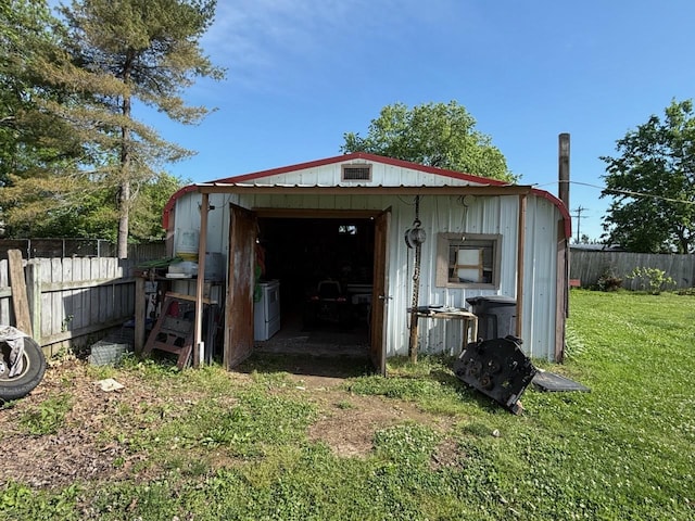 view of outbuilding featuring an outbuilding and fence