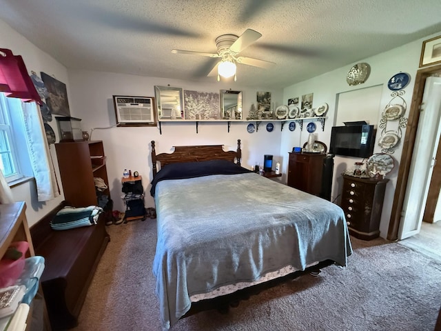 bedroom with carpet flooring, a wall mounted air conditioner, and a textured ceiling