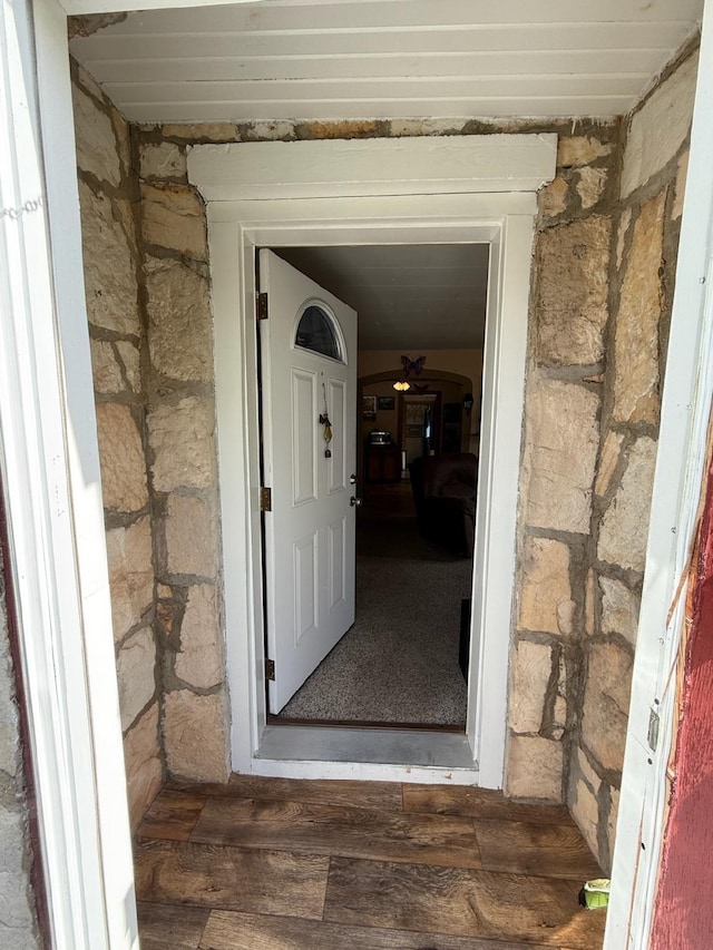 entrance to property with stone siding