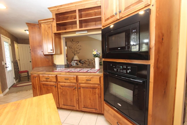 289 Frog Pond Rd, Seymour, MO 65746 - kitchen with brown cabinetry, light tile patterned flooring, open shelves, tile countertops, and black appliances