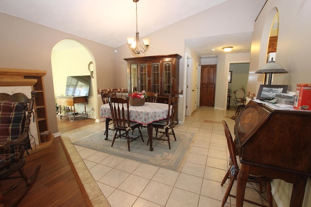 289 Frog Pond Rd, Seymour, MO 65746 - dining room featuring an inviting chandelier, light tile patterned floors, vaulted ceiling, and arched walkways