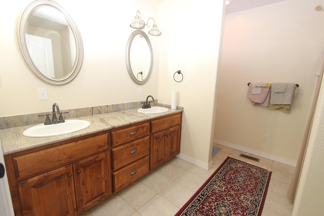 289 Frog Pond Rd, Seymour, MO 65746 - full bath with double vanity, visible vents, tile patterned flooring, and a sink