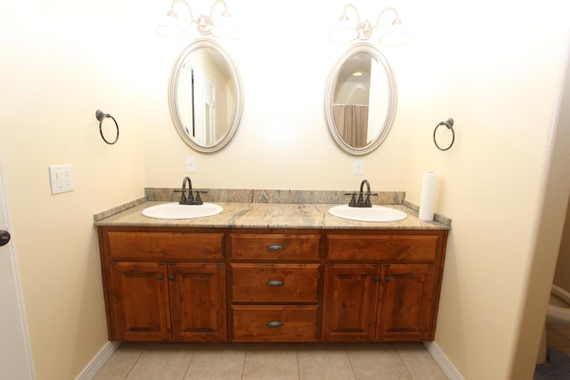 289 Frog Pond Rd, Seymour, MO 65746 - bathroom featuring baseboards, tile patterned floors, double vanity, and a sink