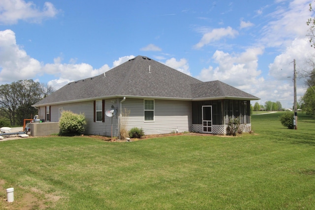 289 Frog Pond Rd, Seymour, MO 65746 - back of property with a sunroom, a yard, and roof with shingles