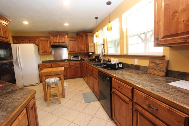 289 Frog Pond Rd, Seymour, MO 65746 - kitchen with a sink, dark countertops, brown cabinetry, pendant lighting, and black appliances