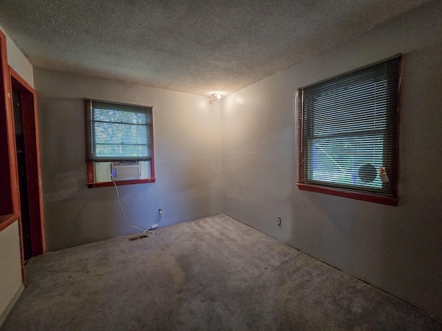 25454 Tulip Pl, Urbana, MO 65767 - carpeted spare room with cooling unit and a textured ceiling