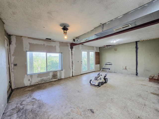 25454 Tulip Pl, Urbana, MO 65767 - interior space featuring a textured ceiling, visible vents, and tile patterned floors