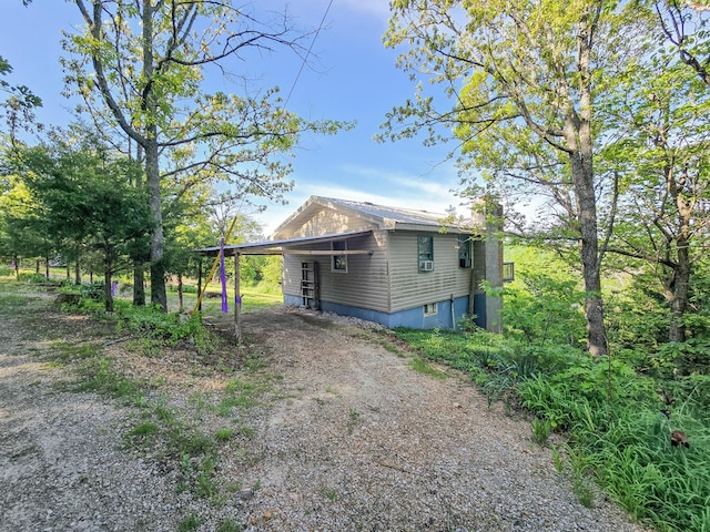 25454 Tulip Pl, Urbana, MO 65767 - view of property exterior with dirt driveway