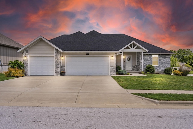 single story home with a lawn, an attached garage, concrete driveway, stone siding, and roof with shingles