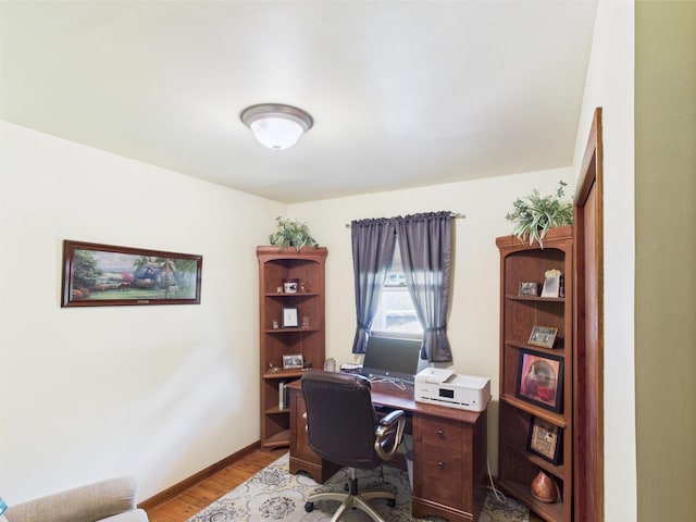 office featuring wood finished floors and baseboards