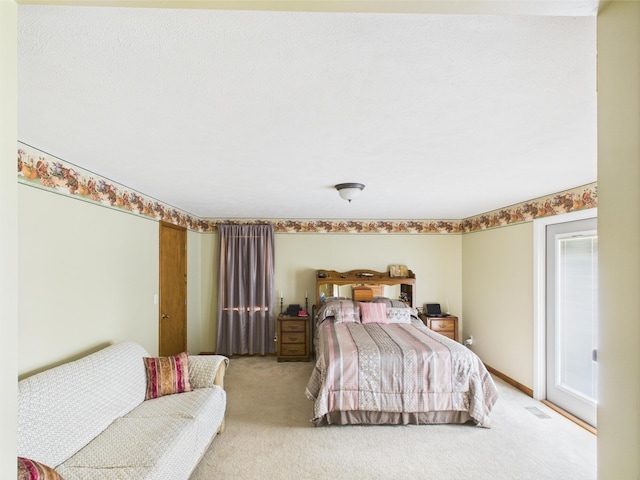 bedroom with light carpet, visible vents, and access to exterior