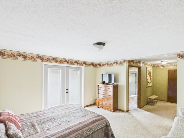 bedroom featuring a textured ceiling, light carpet, french doors, and baseboards