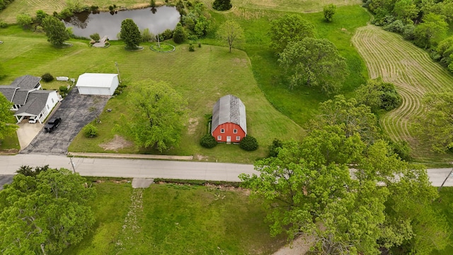 birds eye view of property with a rural view and a water view