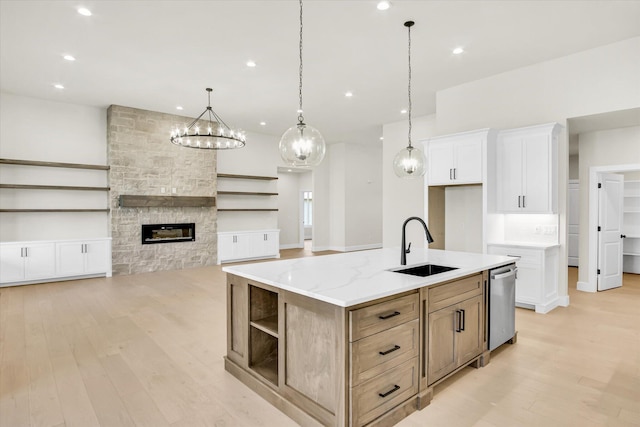 kitchen with open shelves, a sink, dishwasher, light wood-type flooring, and white cabinets