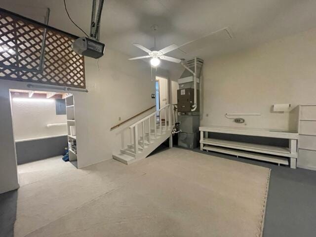 basement with heating unit and a ceiling fan