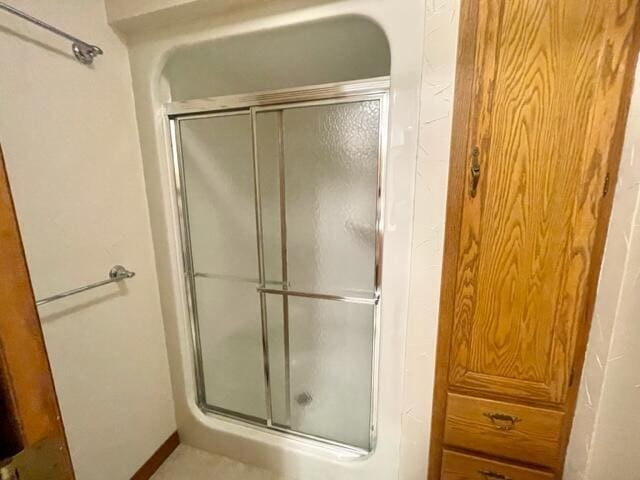 full bath featuring a stall shower