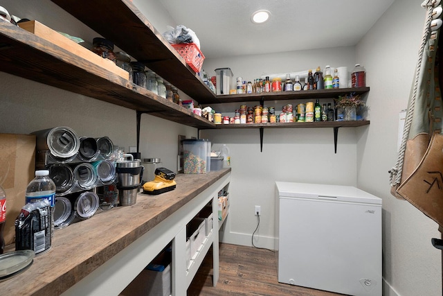 washroom featuring baseboards, recessed lighting, and dark wood-type flooring