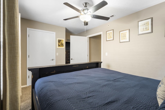 bedroom with ceiling fan, visible vents, and carpet
