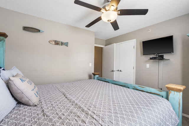 bedroom with ceiling fan and carpet