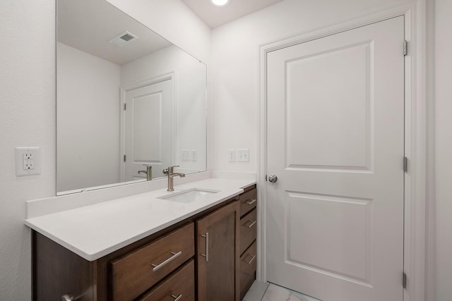 bathroom featuring visible vents and vanity