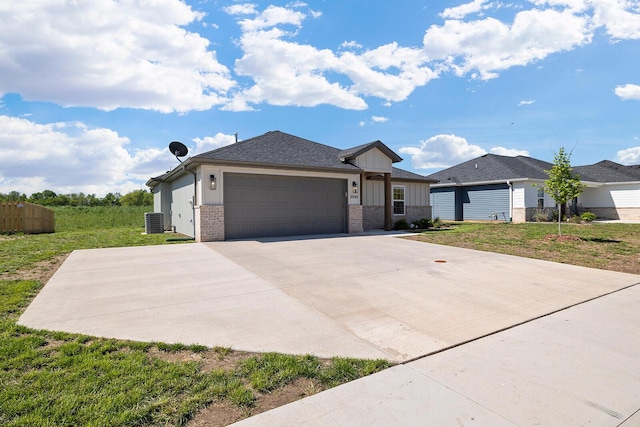 ranch-style house featuring board and batten siding, brick siding, cooling unit, an attached garage, and concrete driveway