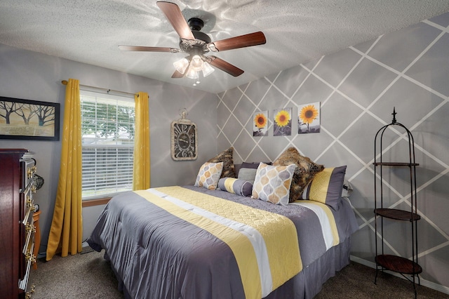 bedroom featuring a textured ceiling, carpet, and a ceiling fan