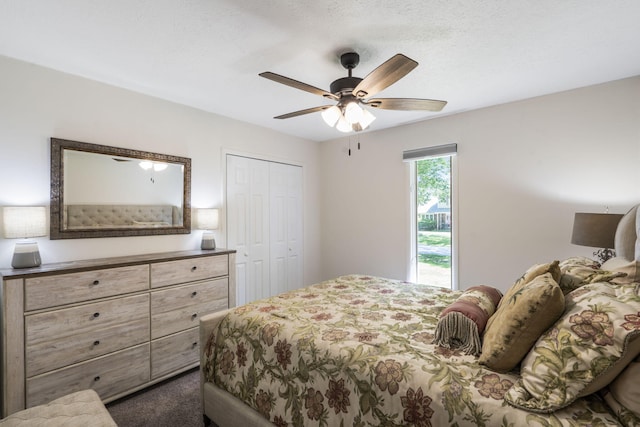 carpeted bedroom with a closet and a ceiling fan