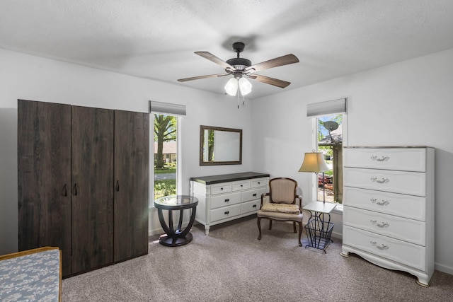 carpeted bedroom featuring a ceiling fan