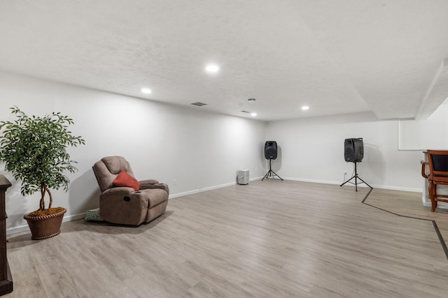 unfurnished room featuring baseboards, visible vents, recessed lighting, and wood finished floors