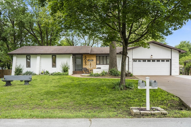 single story home with driveway, a garage, and a front yard