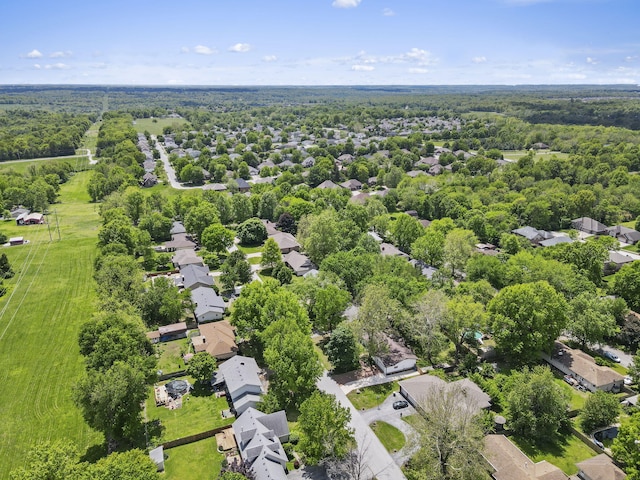bird's eye view featuring a forest view and a residential view