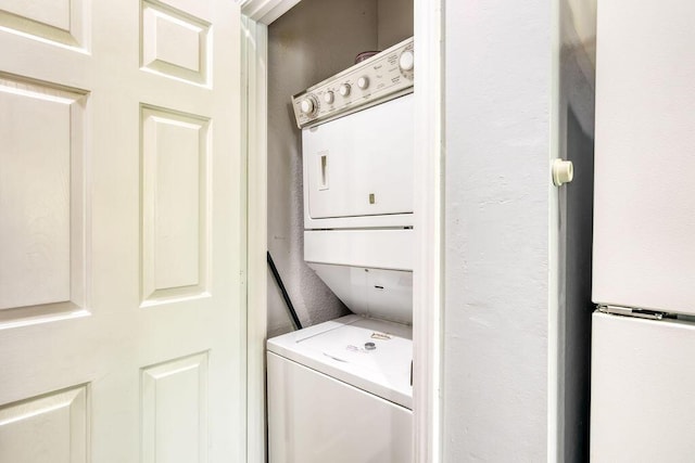 813 Holiday Rdg Unit H-11, Branson, MO 65616 - laundry area with laundry area and stacked washing maching and dryer