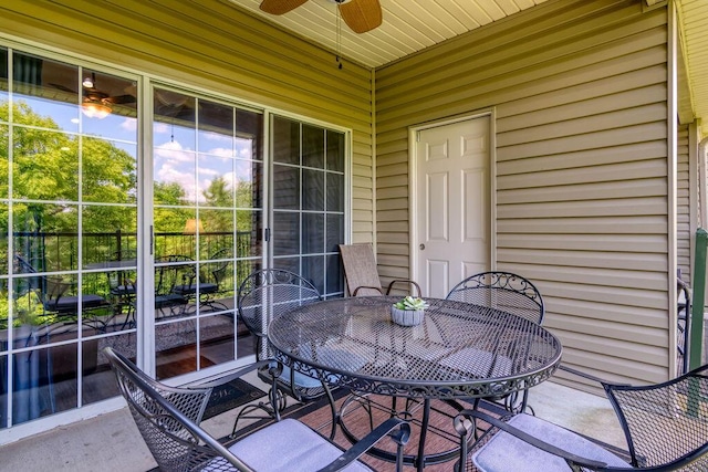 813 Holiday Rdg Unit H-11, Branson, MO 65616 - view of patio featuring ceiling fan and outdoor dining area