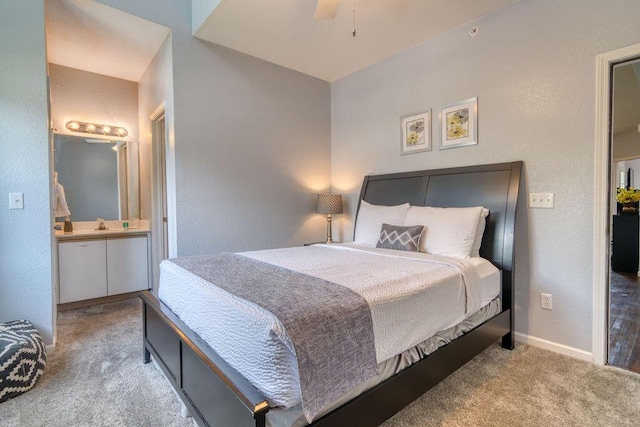 813 Holiday Rdg Unit H-11, Branson, MO 65616 - bedroom with a textured wall, ensuite bathroom, baseboards, and carpet floors
