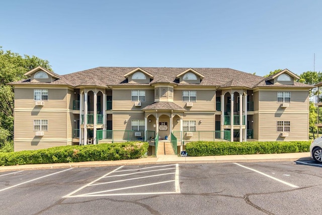 813 Holiday Rdg Unit H-11, Branson, MO 65616 - view of building exterior with uncovered parking