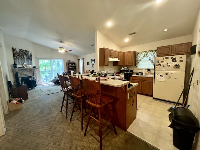 380 Deer Run Rd, Branson, MO 65616 - kitchen with white appliances, lofted ceiling, a peninsula, a kitchen bar, and open floor plan