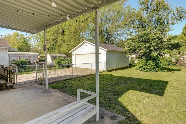 541 S Warren Ave, Springfield, MO 65806 - view of yard with a storage unit, an outdoor structure, a garage, and fence