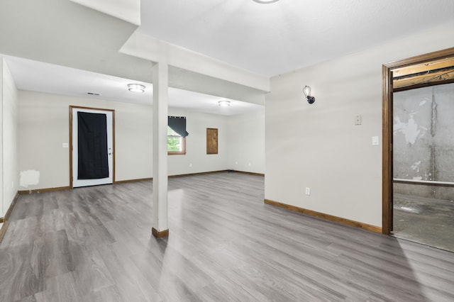 408 Meadowlark Rd, Branson West, MO 65737 - below grade area featuring baseboards and wood finished floors