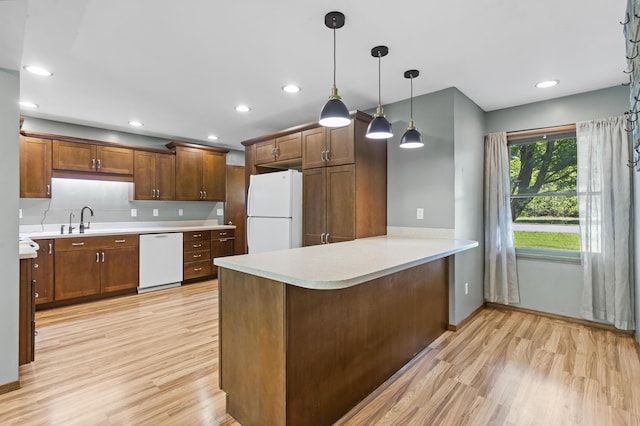 408 Meadowlark Rd, Branson West, MO 65737 - kitchen featuring white appliances, light countertops, tasteful backsplash, and light wood-style floors