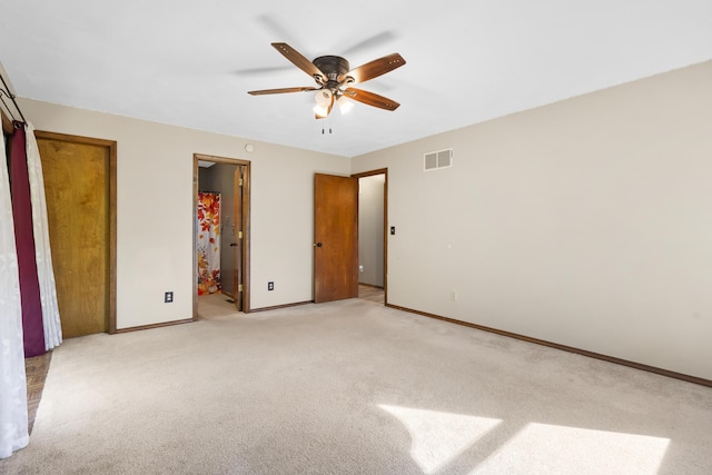 408 Meadowlark Rd, Branson West, MO 65737 - unfurnished bedroom with baseboards, ensuite bathroom, light carpet, and visible vents