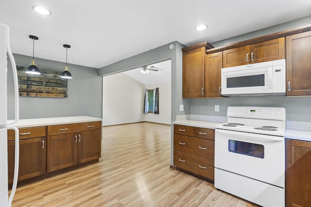 408 Meadowlark Rd, Branson West, MO 65737 - kitchen with light wood-style flooring, decorative light fixtures, white appliances, ceiling fan, and light countertops