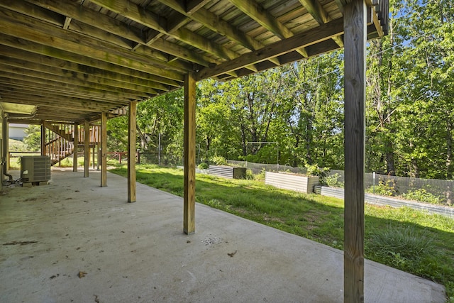 408 Meadowlark Rd, Branson West, MO 65737 - view of patio / terrace with central AC unit, stairs, a vegetable garden, and fence