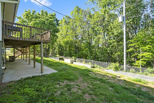 408 Meadowlark Rd, Branson West, MO 65737 - view of yard featuring a patio, a wooden deck, central AC unit, stairway, and a vegetable garden